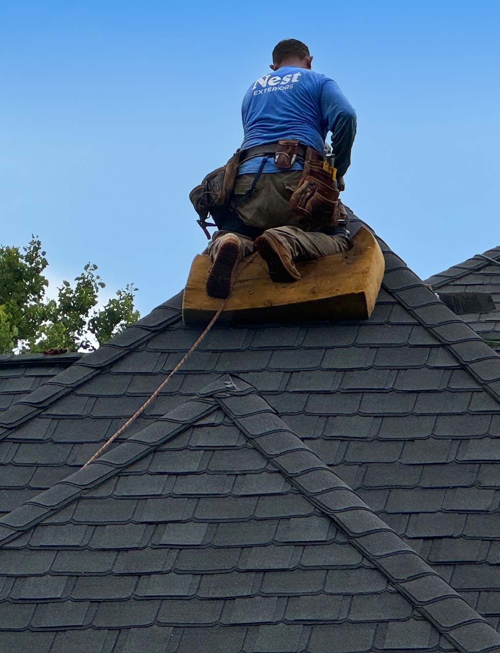 Nest Exteriors roofer at work